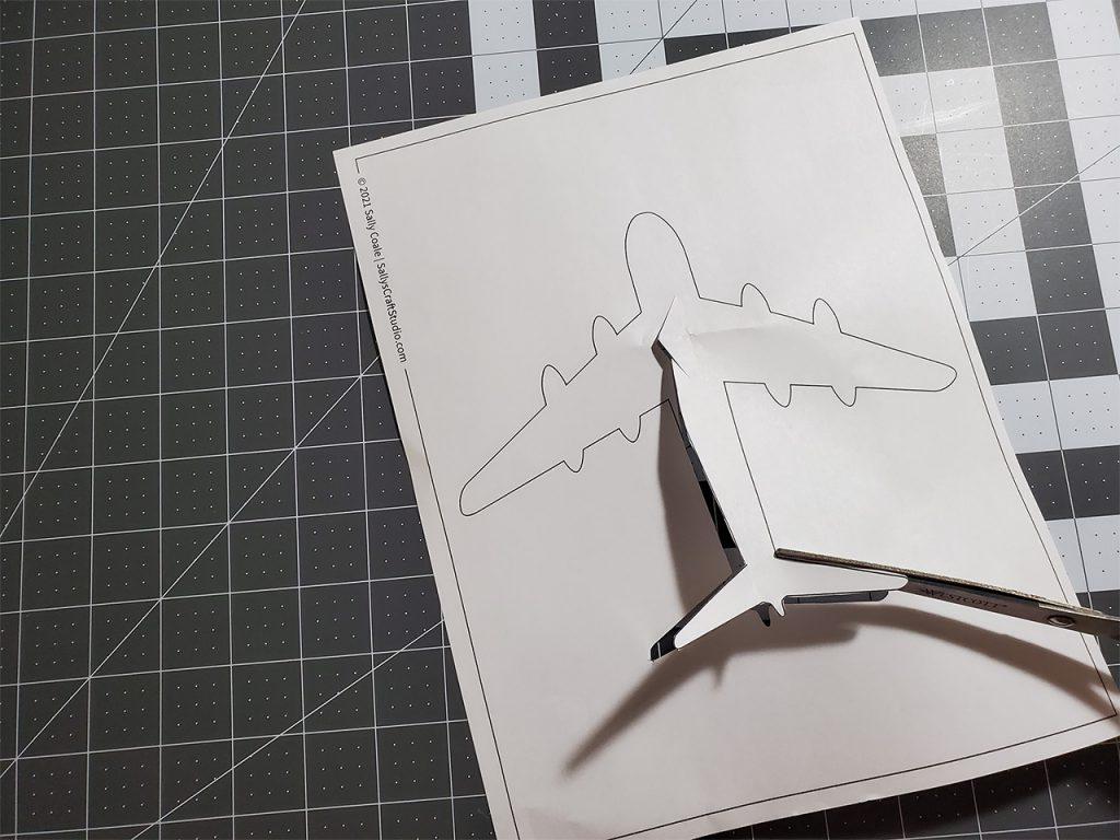 cut template out of the middle of the paper without cutting sides